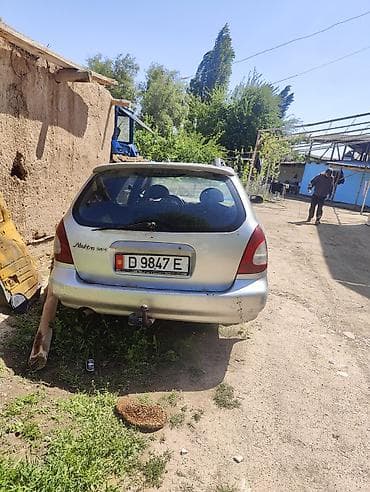 Унаа тетиктери: Mazda Familia/323 Wagon (правый руль), серебристый универсал, номер — 4