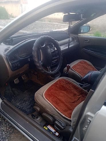 митсубиси спайк стар: Mazda 323: 1996 г., Механика, Бензин, Седан — 4