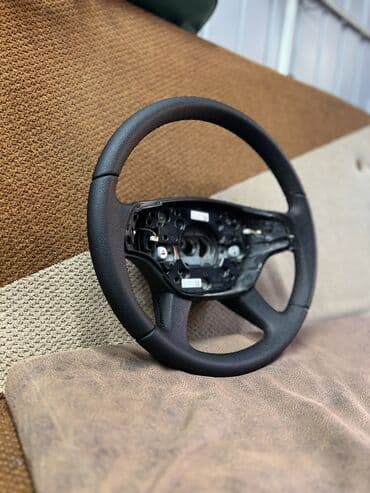 ремонт меховых изделий: Перетяжка Рулей,ручек кпп, юбочки кпп и ручного тормоза,подлокотников — 27