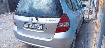 машина ваз: Хэтчбек Honda Jazz серебристого цвета, представленный на изображениях — 5