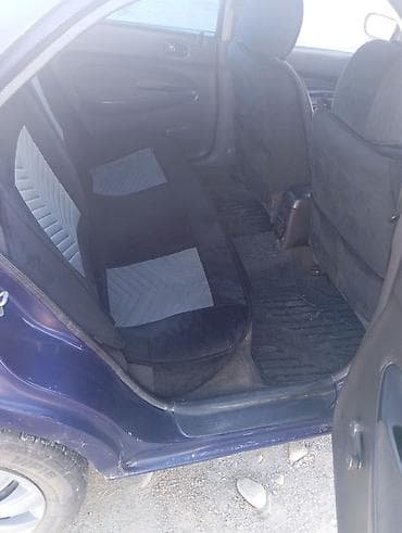 lx 470 2007: Mazda 323: 1996 г., 1.5 л, Механика, Бензин, Седан — 6