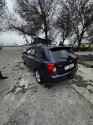 mitsubishi evolution: Mazda 323: 2002 г., 1.6 л, Ручные, Бензин, Универсал — 3