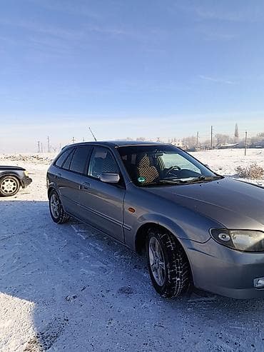 e 34 bmv: Mazda 323: 2002 г., 1.6 л, Механика, Бензин, Универсал — 7