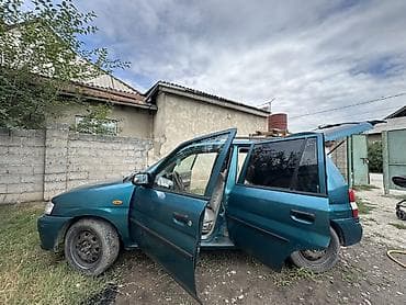 Продажа авто: Mazda Demio: 1999 г., 1.3 л, Механика, Хэтчбэк — 6