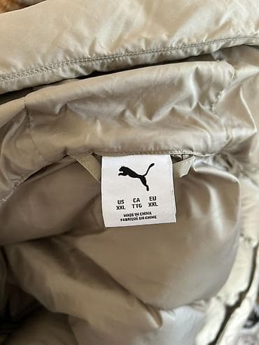 Плащи: Puma пуховик с капюшоном, размер EU XXL (US XXL/CA TTG). Цвет — 2