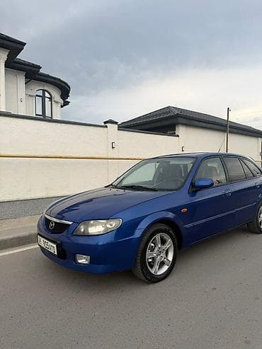 Унаа: Mazda 323: 2003 г., 1.6 л, Кол менен иштөөчү, Бензин, Хетчбек — 3