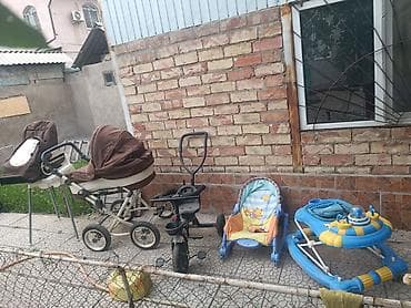 Детские товары комплектом. Состав: - Универсальная коляска 2-в-1