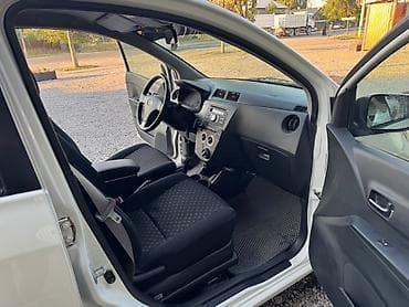 byd e1: Daihatsu Cuore: 2009 г., 1 л, Автомат, Бензин, Хэтчбэк — 9
