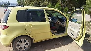 женский авто: Mazda Demio: 2004 г., 1.5 л, Автомат, Бензин, Хэтчбэк — 5