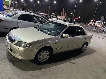 Транспорт: Mazda 323: 2003 г., Механика, Газ, Седан — 3