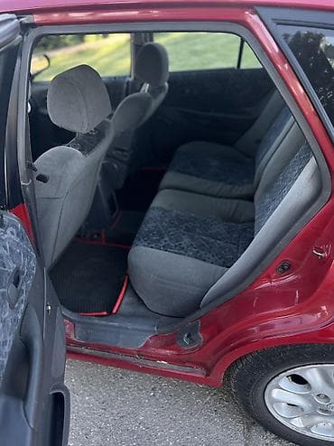 ваз 2112: Mazda 323: 1998 г., 1.5 л, Механика, Бензин, Хэтчбэк — 9