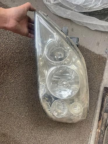 Автокосметика: Передняя левая фара Nissan 2003 г., Б/у, Оригинал — 2