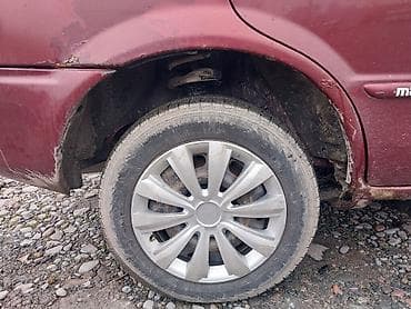 шлем токмок: Mazda 323: 2002 г., 1.5 л, Механика, Бензин, Универсал — 5