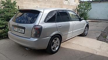 jetta volkswagen: Mazda 323: 2002 г., 1.6 л, Механика, Бензин, Хэтчбэк — 4