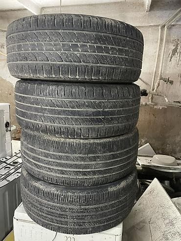 235 55 18 шина: Комплект летних шин 235/55 R18 104V (4 штуки). Состояние: Среднее — 4