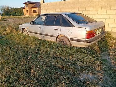 люк 124: Mazda 626: 1990 г., Хэтчбэк — 3