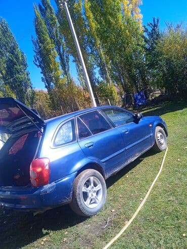 диски на опель зафира а: Mazda Familia: 2002 г., 1.6 л, Автомат, Бензин, Хэтчбэк — 1