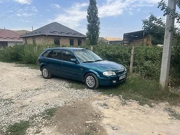 Mazda 323: 1999 г., 1.5 л, Автомат, Бензин, Хэтчбэк — 6