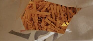 Nails: Желтый пластиковый дюбель с рельефной поверхностью и крыльями — 2