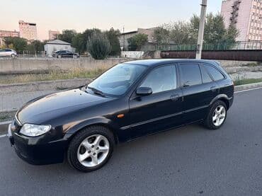 полик нексия 2: Mazda 323: 2002 г., Механика, Универсал — 4