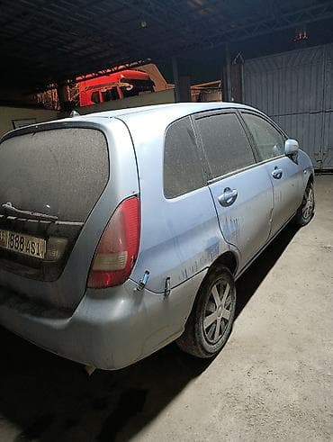 боковой ряд: Suzuki Liana: 2002 г., Механика, Бензин, Универсал — 2