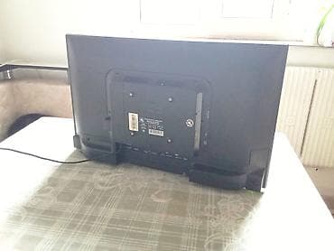 iphone хr: Телевизор VITYAS (жк/LED), диагональ около 24–26". На корпусе сзади — 1