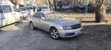 mazda famila: Nissan Gloria: 2002 г. — 1