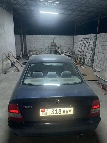 кузов нексия 2: Mazda 323: 1999 г., 1.6 л, Механика, Бензин, Седан — 2