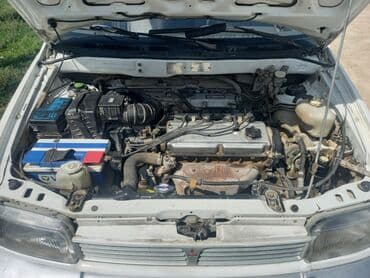 доставка аккумулятора бишкек: Просторный минивэн белого цвета с рейлингами на крыше — 12