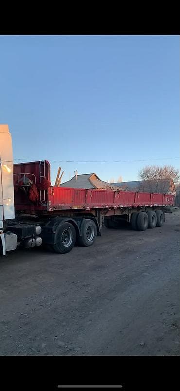 жумбо прицеп: Полуприцеп бортовой (красный), 3-осный. Характеристики по заводской — 3