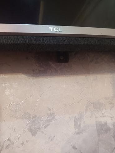 Телевизор TCL с диагональю около 43–50" (тонкая рамка, нижняя планка