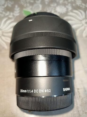 материал на чехол: Объектив Sigma 30mm f/1.4 DC DN (диаметр фильтра 52 мм) - Фокусное — 1