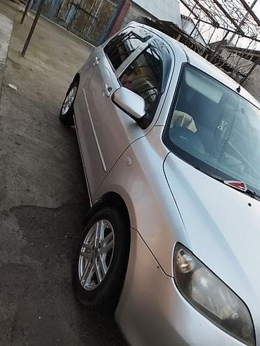 byd plus: Mazda Demio: 2004 г., 1.4 л, Автомат, Бензин, Седан — 5