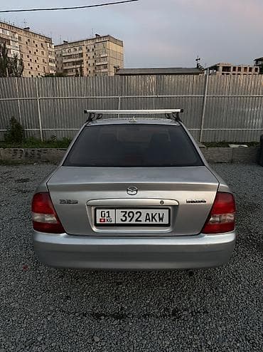 pes 2013: Mazda 323: 2003 г., 1.6 л, Механика, Бензин, Седан — 5
