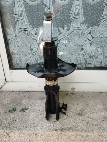 Передний амортизатор Mazda 2000 г., Новый, Япония