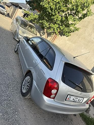 колонка microlab: Mazda 323: 2002 г., 1.6 л, Механика, Бензин, Универсал — 2