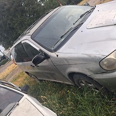 Унаа: Kia Carnival: 1998 г., 2.9 л, Кол менен иштөөчү, Дизель, Вэн/Минивэн — 5