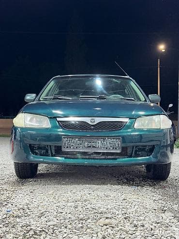 е34 люк: Mazda 323: 2000 г., 1.3 л, Механика, Бензин, Седан — 1
