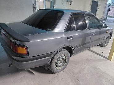 кызыл бирдик: Mazda 323: 1989 г., 1.6 л, Кол менен иштөөчү, Бензин, Седан — 4