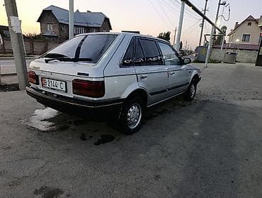 уаз hunter: Mazda 323: 1985 г., 1.5 л, Механика, Бензин, Хэтчбэк — 5