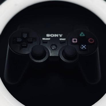 Игровая консоль Sony PlayStation 3 (Slim) с беспроводным геймпадом