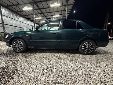 е34 люк: Mazda 323: 2000 г., 1.3 л, Механика, Бензин, Седан — 3