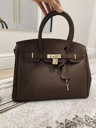 secret key: Сумка-эрмес из фактурной коричневой кожи с золотистой фурнитурой. - — 2