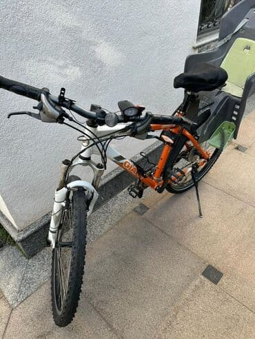 самый лучший трехколесный велосипед с ручкой: Горный велосипед с детским креслом. Основные особенности: - Рама — 2