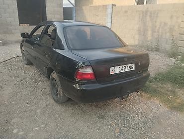 Mazda 323: 1996 г., 1.8 л, Механика, Бензин, Седан — 3