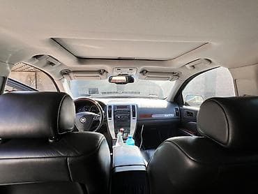 что за машина: Cadillac STS: 2007 г., 4.6 л, Бензин, Седан — 6