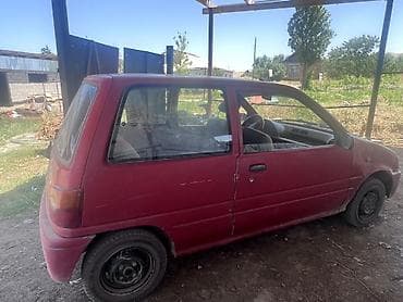 масла прес: Daihatsu Cuore: 1994 г., 0.8 л, Механика, Бензин, Купе — 2