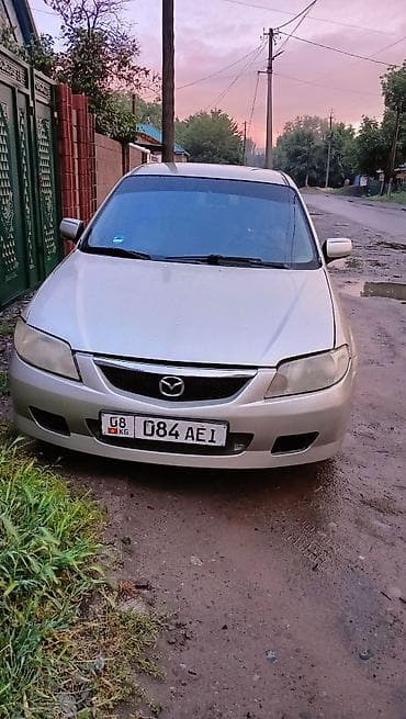 Транспорт: Mazda 323: 2003 г., 1.6 л, Кол менен иштөөчү, Бензин, Хетчбек — 2