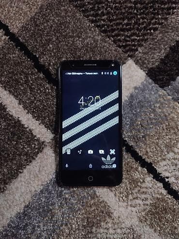 p 10: Alcatel Pop 4 (Серый) Телефон компактный, удобно лежит в руке — 1