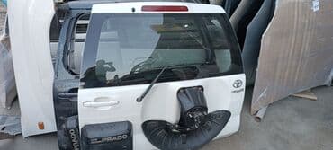 прад: Прадо 120 кузов. авто запчасти. крышка по запаску. оригинал кузовное — 1